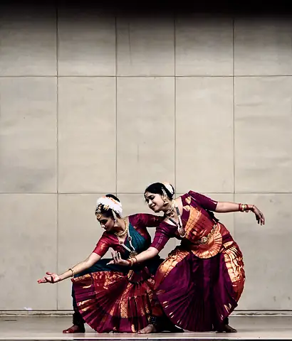 Two performers dancing in colorful dress