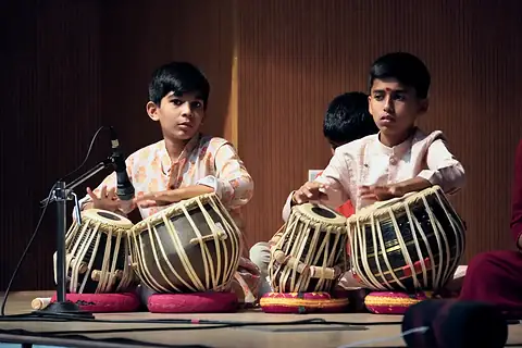 Two students playing tabla at the Swaranjali Sangeet Sabha