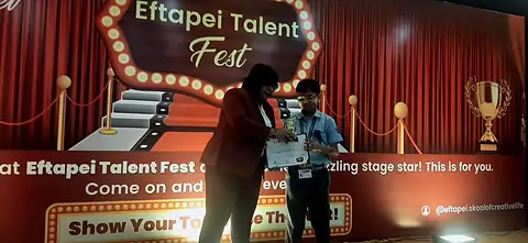 Naitik Nemish Mehta with his award from the Eftapei Talent Fest