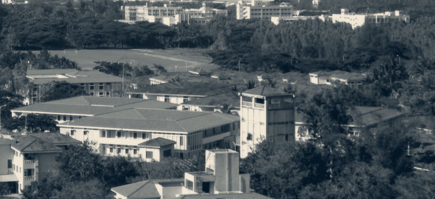 The CIRS campus seen from above, its buildings and playing fields set among the trees of the Siruvani foothills