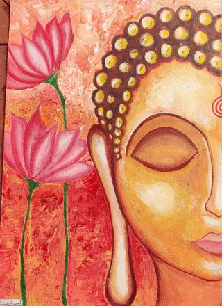 The Buddha's face with closed eyes, beside pink lotuses on a glowing orange ground