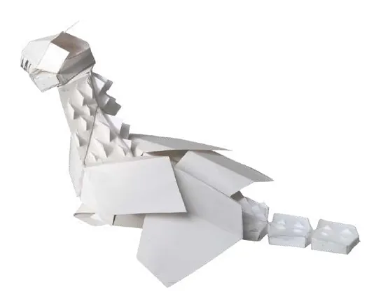 A long-necked creature folded from white paper