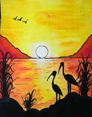 Two cranes silhouetted before a sun setting into an orange lake