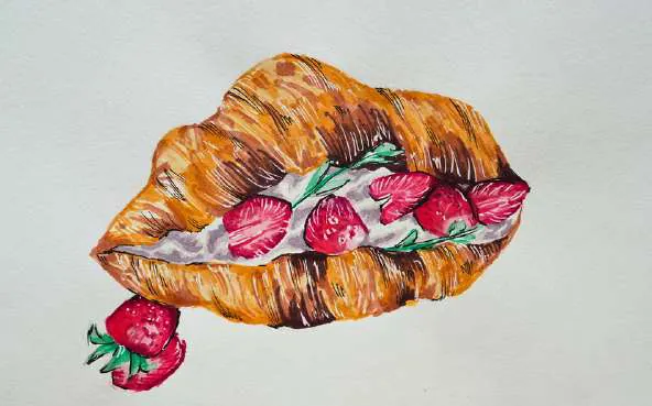 A croissant filled with strawberries and cream