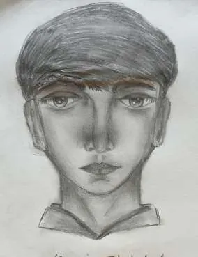 A young man in a cap, in grey