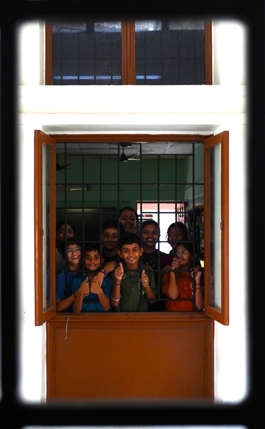 Children looking out of a window