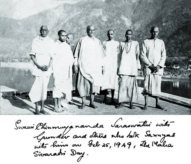 A group beside water above a handwritten caption.