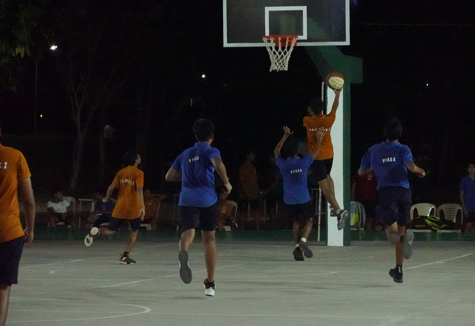 Valmiki players in named yellow shirts in an inter-house basketball game
