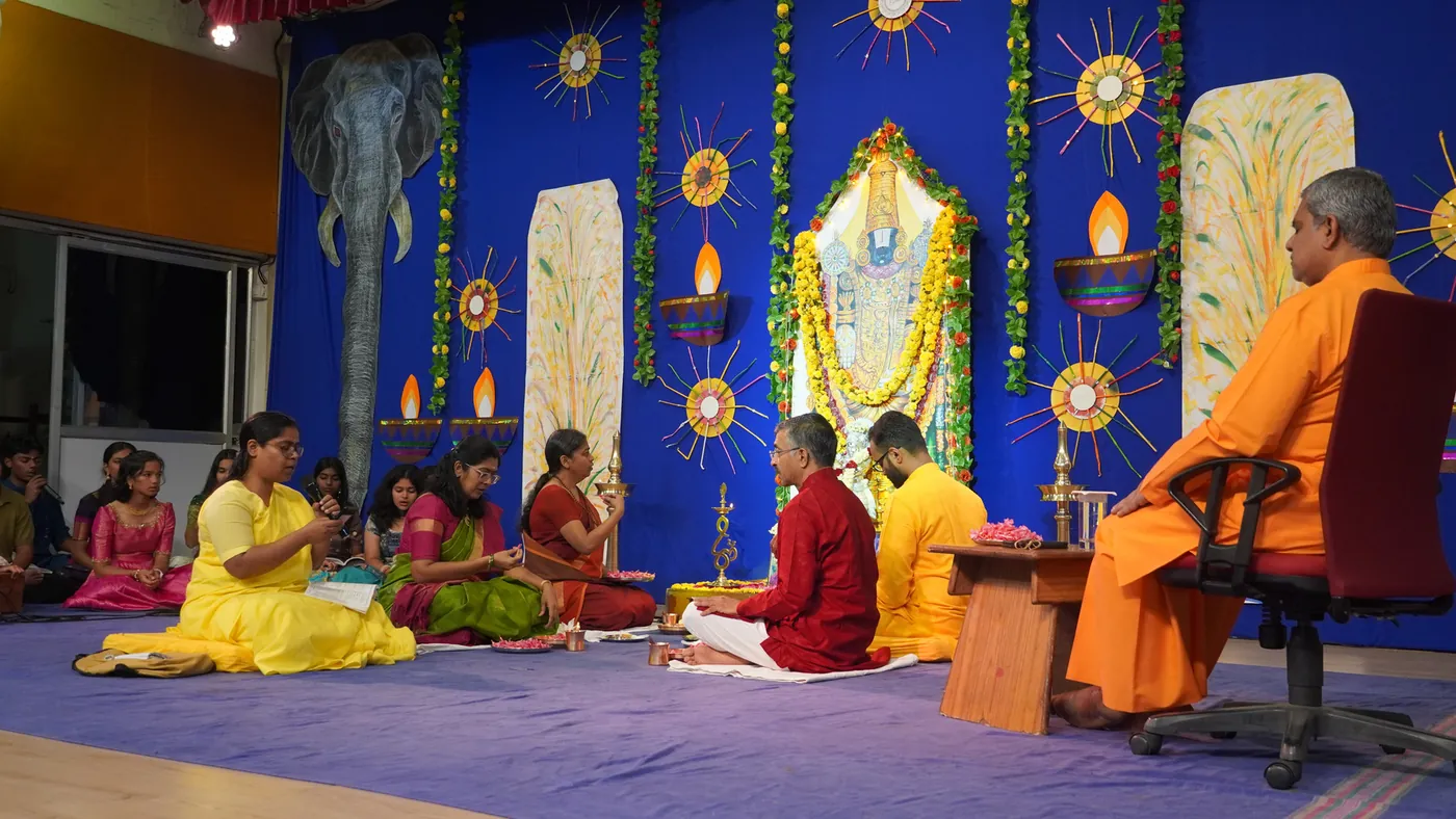 Students seated before the altar at the Krishna Pooja on Diwali morning