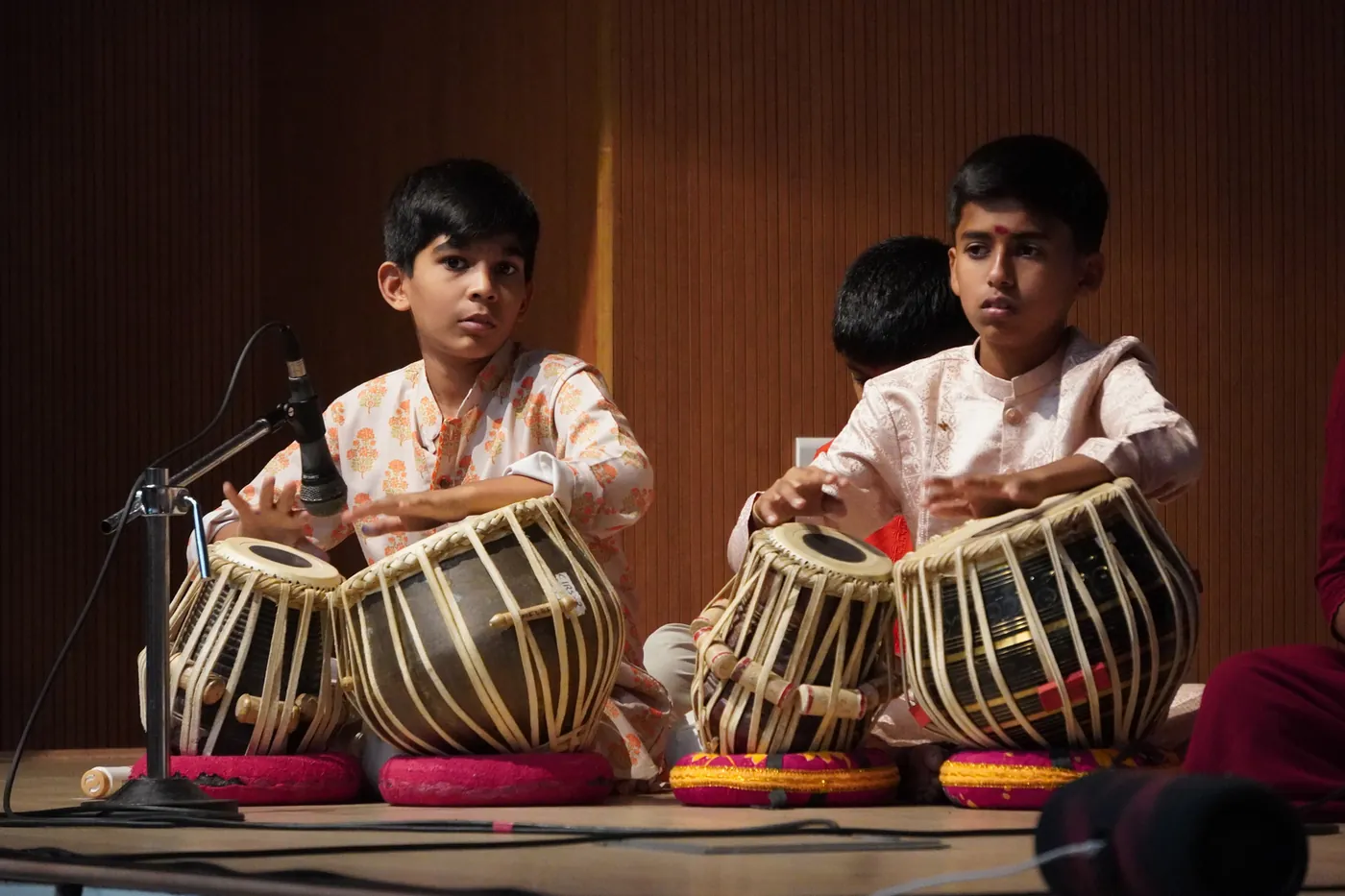 Two students playing tabla at the Swaranjali Sangeet Sabha