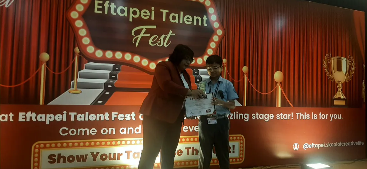 Naitik Nemish Mehta with his award from the Eftapei Talent Fest