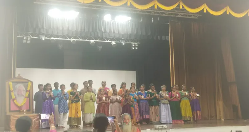 Students on stage at the Tamil Bhagavad Gita Chanting competition