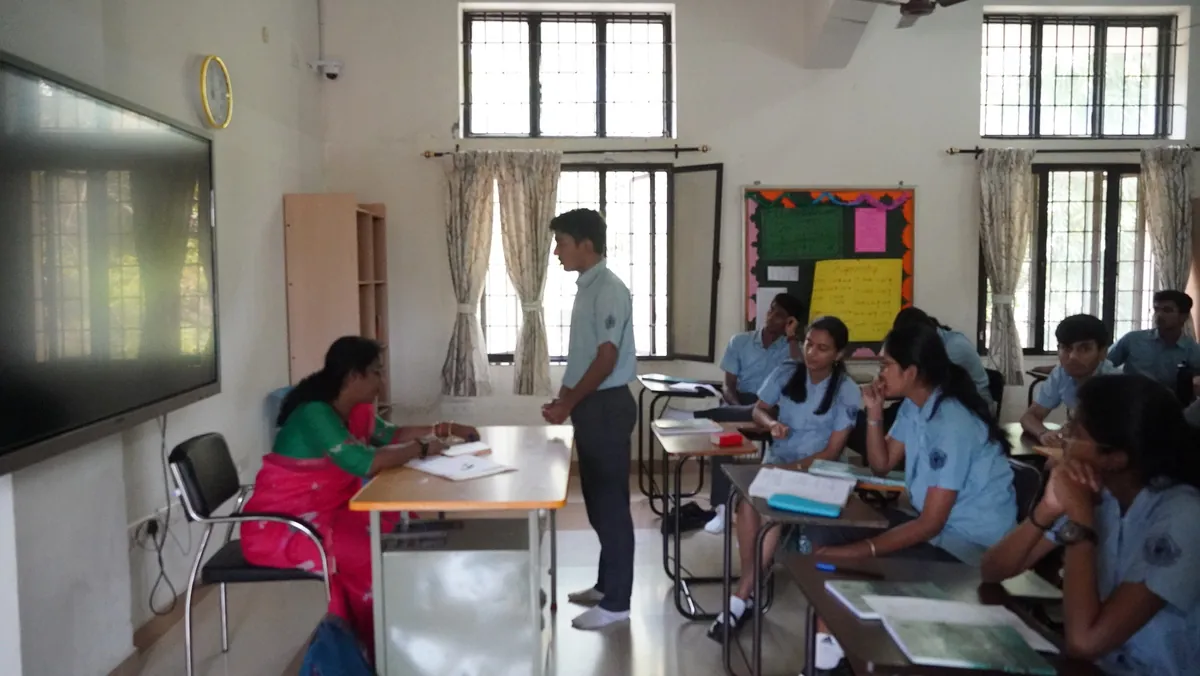Students waiting their turn at the district-level Gita chanting competition