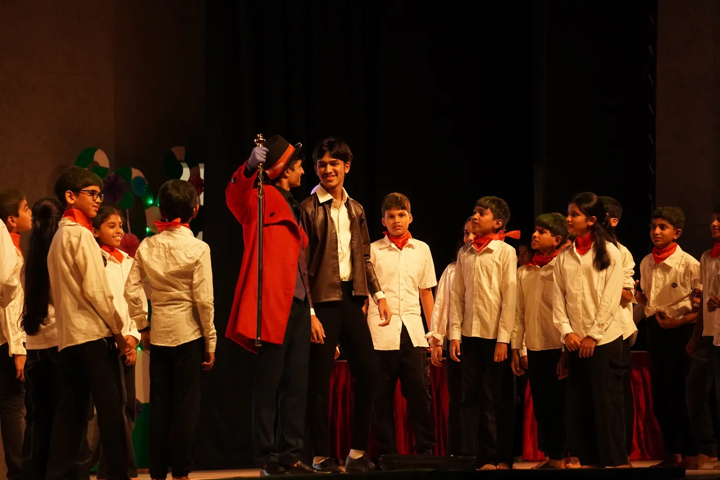 A Masquerade cast on stage in costume