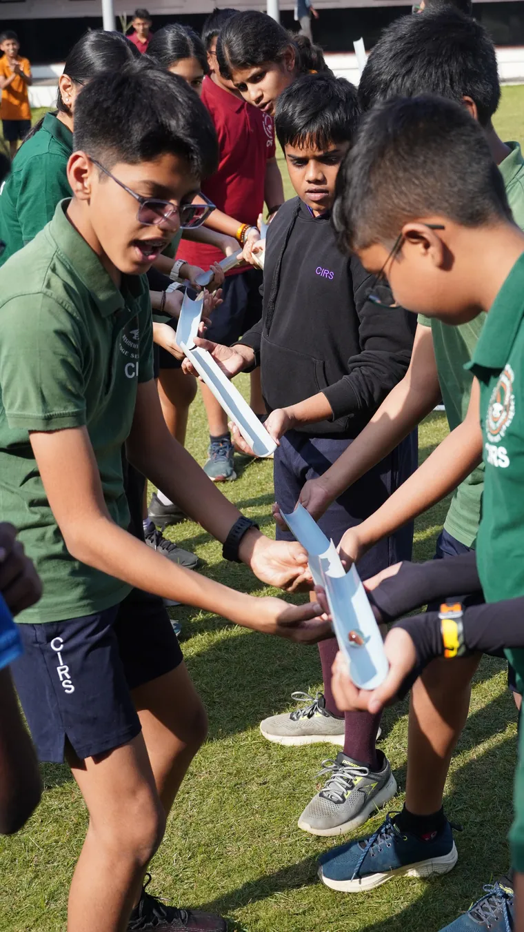 Students playing a game outdoors on National Youth Day