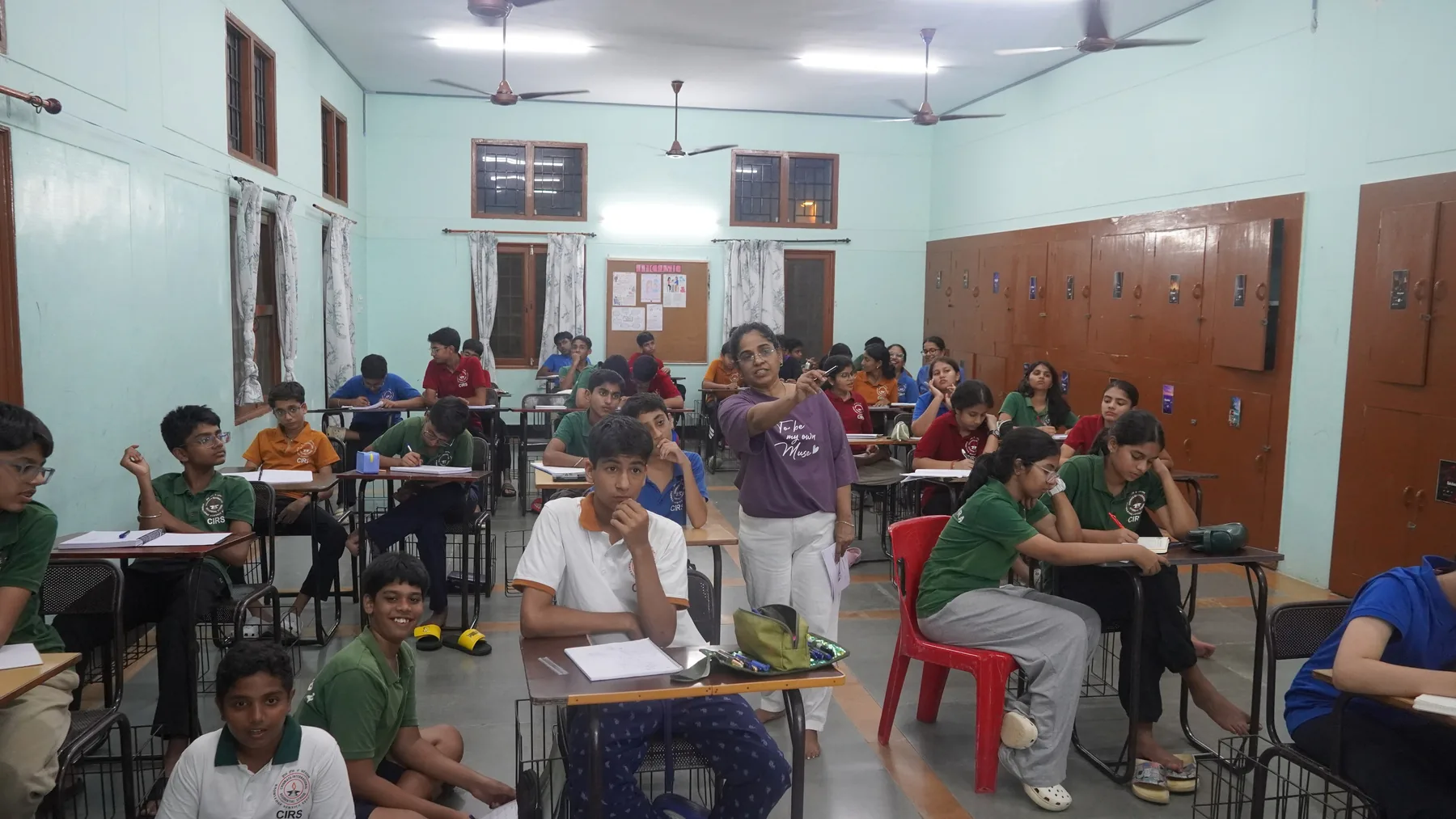 Students working at desks in a classroom