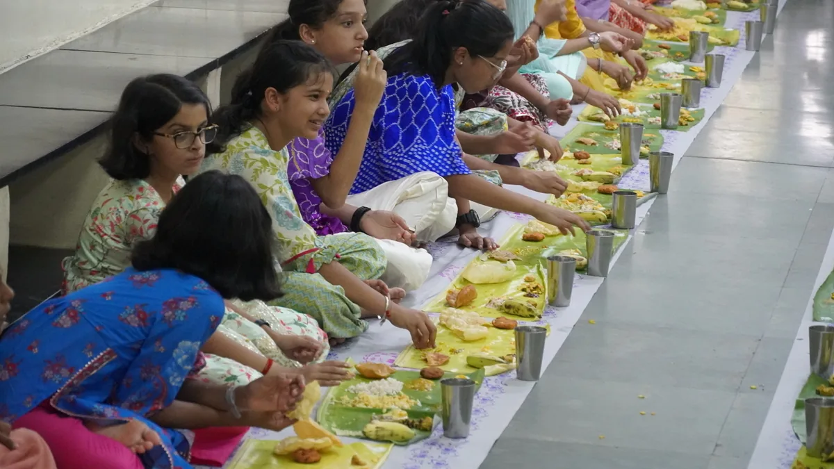 CIRS students sharing a festive meal served on banana leaves