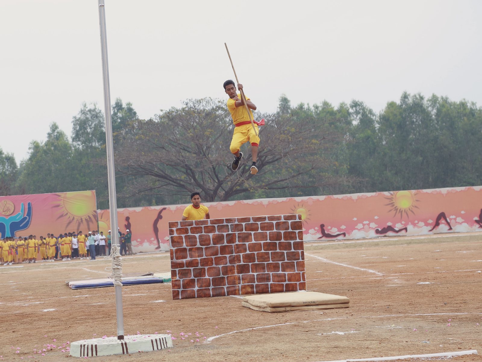 High jumper clearing the bar against clear sky at CIRS