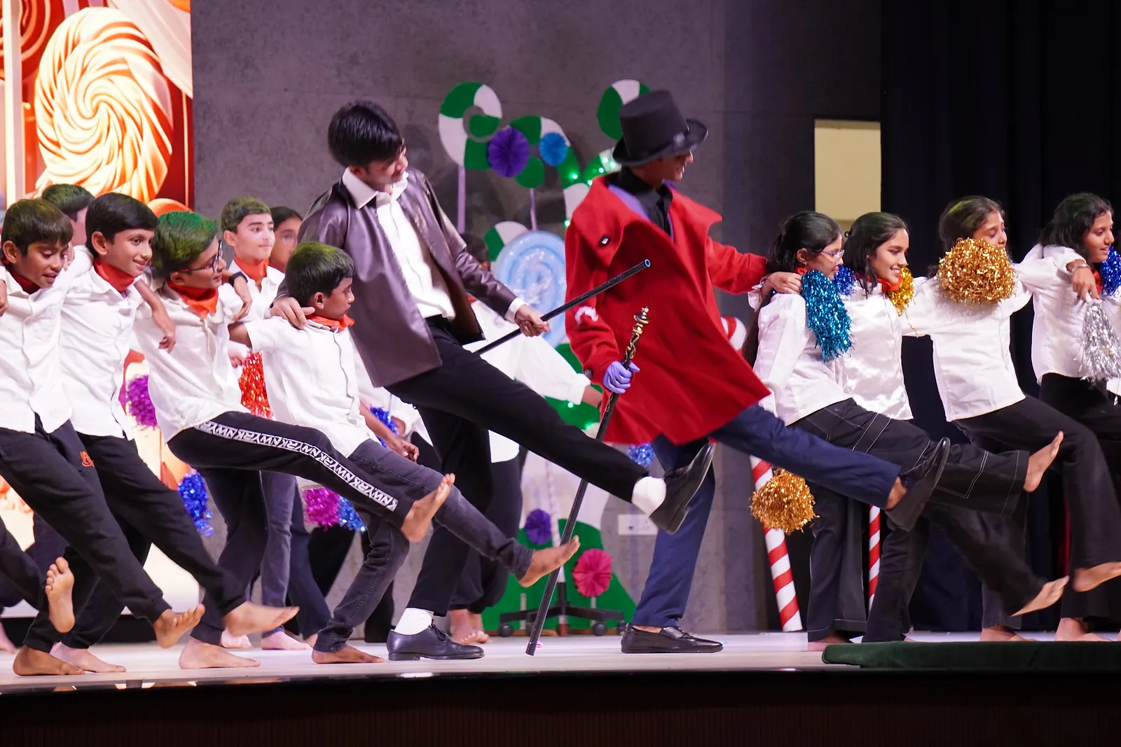 Valmiki performers dancing together across the Melora stage