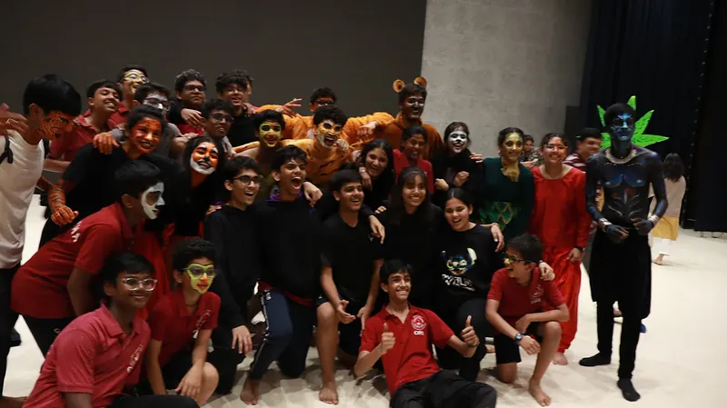 The company after the show, still in face paint and costume