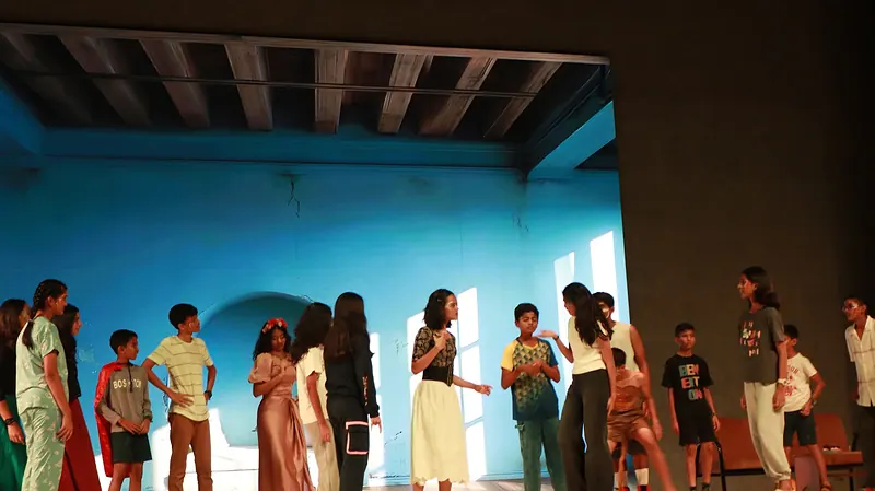 The company across a blue courtyard set